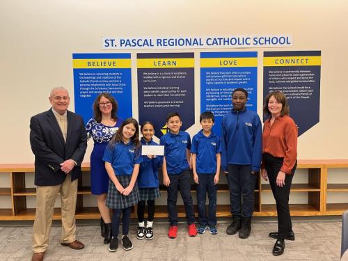 St.-Pascals-Regional-Catholic-Julie-Hurley-and-Tom-Gagliardi-with-Principal-Inna-Collier-Paske